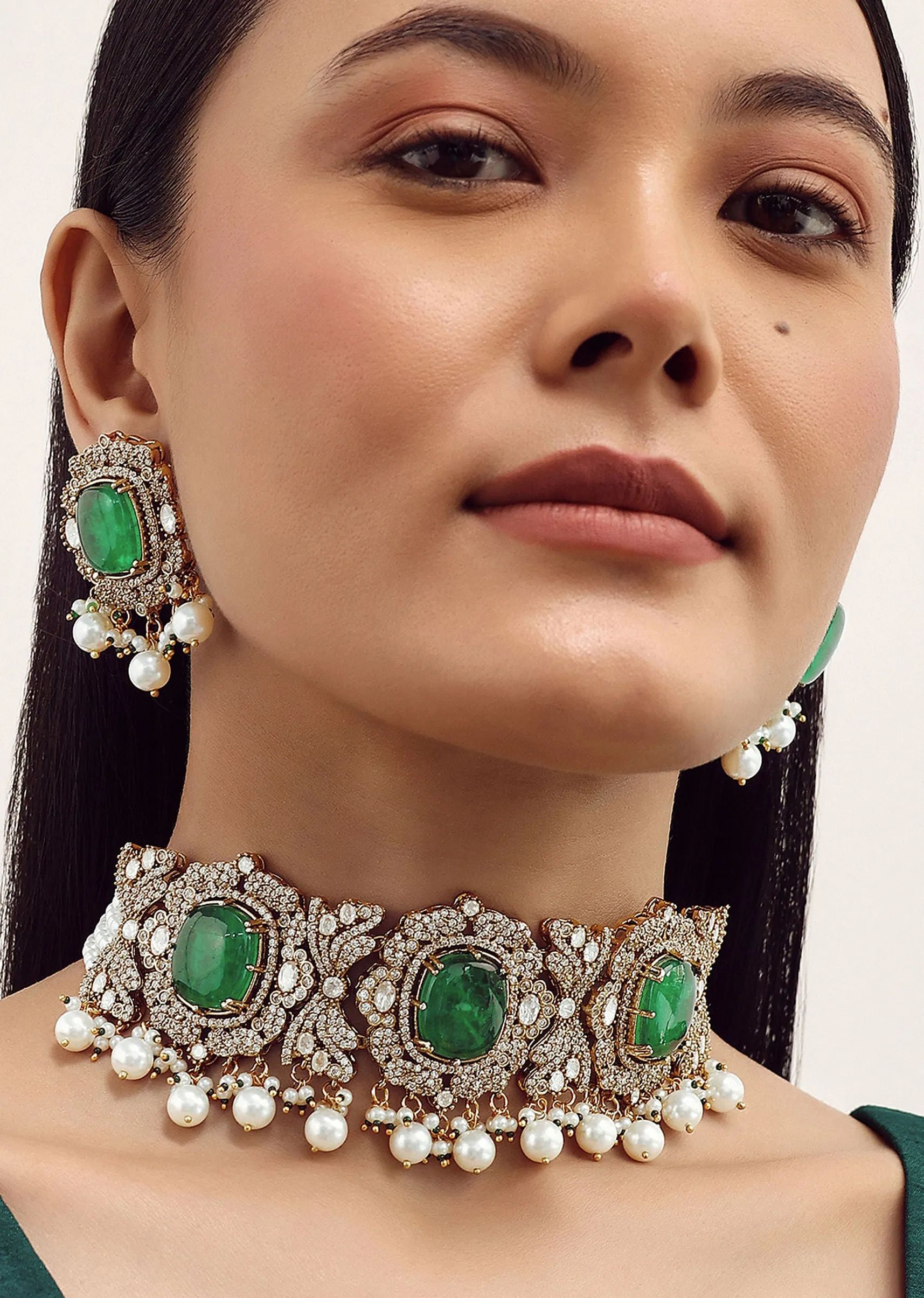 Gold Finish Necklace Set With Emerald Stone In Mix Metal